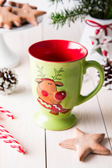 Christmas mug on a wooden white background. Copy space. Christmas concept.
