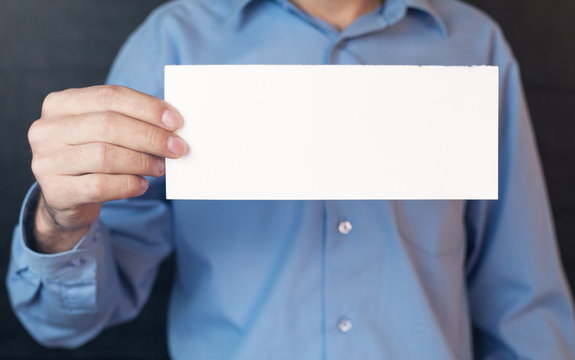 Man holding blank paper.