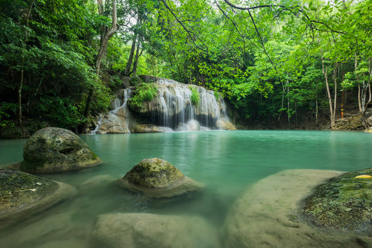 Breathtaking green waterfall at deep forest, Erawan waterfall located Kanchanaburi Province, Thailand © peangdao
