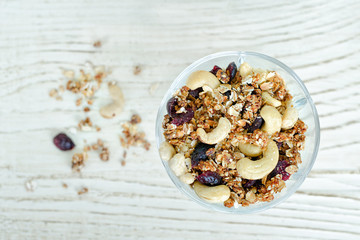 Pialat granola with nuts on a white table. Close-up