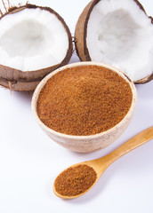 Coconut with coconut sugar isolated on white background.