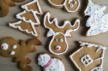 Christmas gingerbread cookies on wooden background.