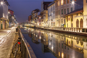 Fototapeta na wymiar Bridge across the Naviglio Grande canal at night, Milan, Lombardia, Italy