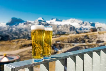 Zelfklevend Fotobehang A glass of fresh beer on mountains © dimasobko