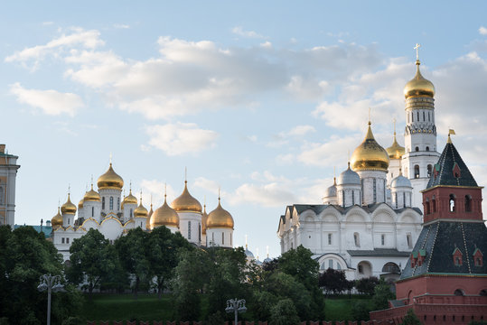 Kremlin panorama in summer: the Big Palace, Ivan the Great Bell Tower, the Moscow river embankment. Blue sky with clouds background.