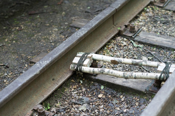 Dynamite pack with wires on the train tracks. Railway.