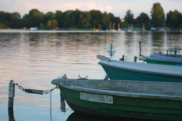 Naklejka na ściany i meble Boats outdoor in a park with a big lake
