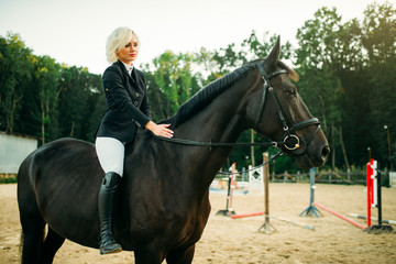 Equestrian sport, woman on horseback, side view