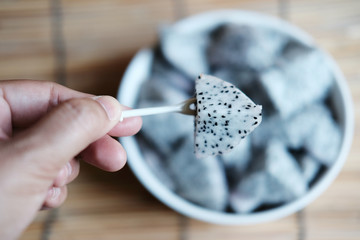 Dragon fruit sliced on the white plate,copy space