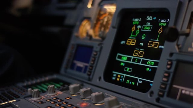 Autopilot control element of an airliner. Panel of switches on an aircraft flight deck. Thrust levers of a twin engined airliner. Pilot controls the aircraft. Onboard computer, cockpit