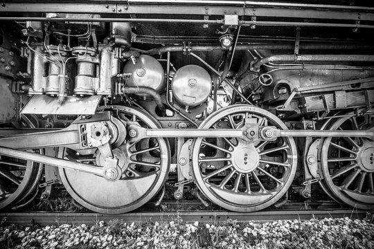Wheels of an old steam locomotive.