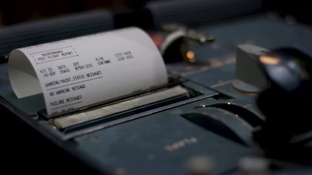 Receipt. Cash receipt illustrating the spent money. Closeup of a hands counting on a cash register on dark background.