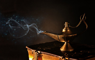 Image of magical aladdin lamp with glitter smoke. Lamp of wishes
