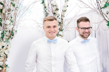 Young handsome best men on wedding day, indoors