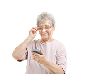 Elderly woman using cell phone, isolated on white