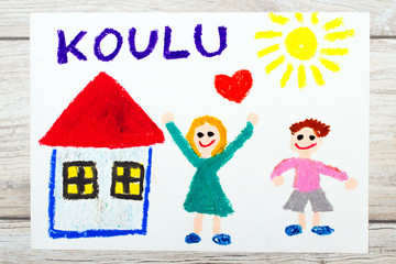 Photo of  colorful drawing: Finnish word SCHOOL, school building and happy children. First day at school.