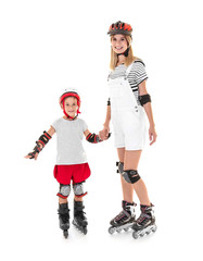Woman with son on roller skates against white background