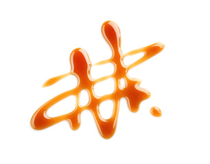 Delicious caramel sauce on white background