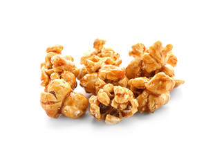 Tasty caramel popcorn on white background