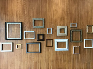 Empty classic wood frame on wooden wall