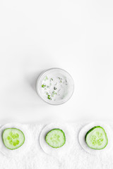 Cucumber moisturising cream or mask pattern. White background top view copyspace