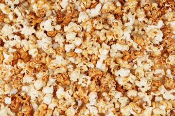 Tasty caramel popcorn as background
