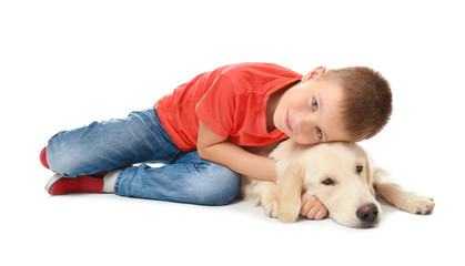 Cute little boy with dog on white background