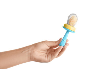 Woman holding baby's nibbler on white background