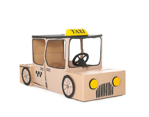 Cardboard taxi on white background