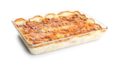 Delicious potato casserole in baking dish, isolated on white