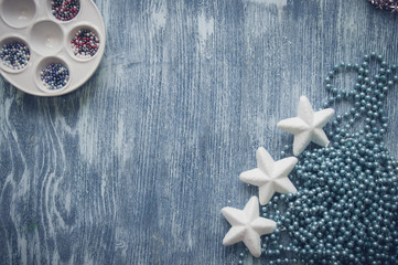 christmas background with holiday ornaments on blue wood background and copy space