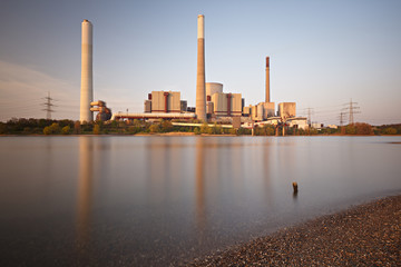 Fototapeta na wymiar Power Station At River Long Exposure