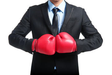 Businessman in boxing gloves on white background