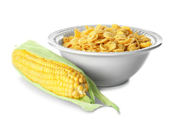 Plate with cornflakes and cob on white background