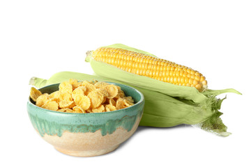 Dish with cornflakes and cobs on white background