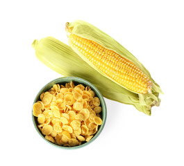 Dish with cornflakes and cobs on white background