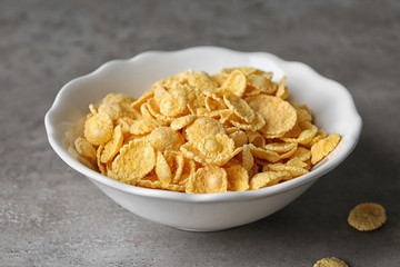 Plate with cornflakes on table