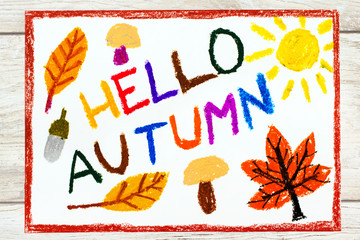 Photo of colorful drawing: Words HELLO AUTUMN mushrooms, acorn, yellow and orange leaves