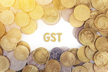 Background of the gold coin with word GST in the middle.