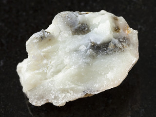 raw talc stone on dark background