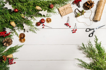 Juniper branches with a Christmas decor. Christmas, New Year background. Coniferous branches of juniper. Top view, flat design.