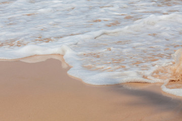 Soft wave of ocean on sandy beach in Phuket Thailand