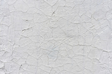 cracked wall background. Cracked wall with old layers of paint.