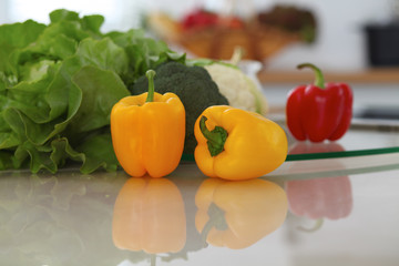 Kitchen interiors. Many vegetables and other meal at glass table are ready for been cooked soon
