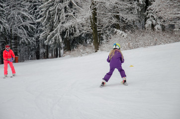 little child learning to ski