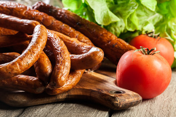 Assorted smoked sausages on a cutting board