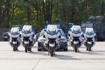 german feldjaeger, military police motorcycles and vehicles stands in formation