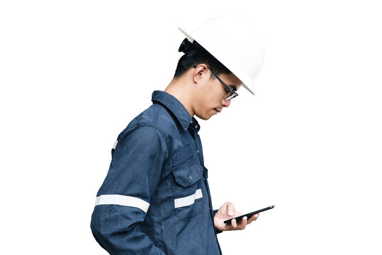 Asian Man,Engineer Or Technician In White Helmet, Glasses And Blue Working Shirt Suit Using Smart Phone, Isolated On White, Mechanic And Oil And Gas Industrial Concept With Clipping Path