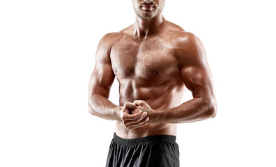 Fototapeta premium Portrait young sexy handsome man of strong athlete's body with bare torso. Posing on white studio background