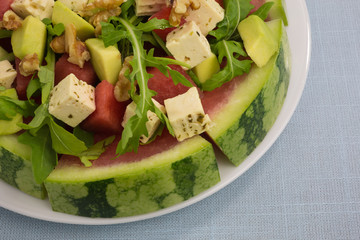 salad of watermelon with avocado and feta with rocket